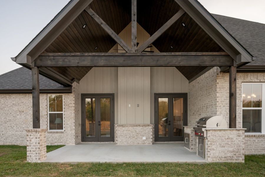 Exterior details and patio area of a home in Windmill Hill, Bryan (Image 35).