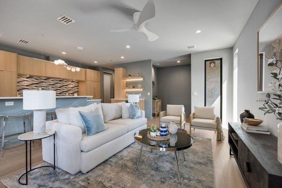 Living room has plenty of room for the gang to hang out or meet up for work. Whether you're home alone or amongst friends the light pours in.