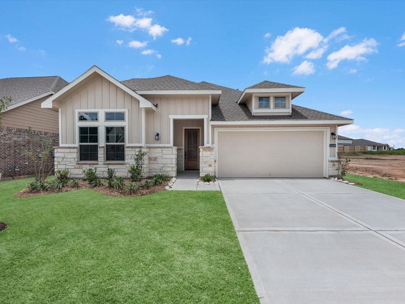 Front exterior of a new home in Spring Creek Trails, Magnolia, TX, highlighting curb appeal (Image 1). Front exterior of a new home in Spring Creek Trails, Magnolia, TX, highlighting curb appeal (Image 1).