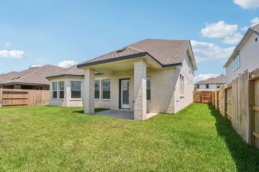Front exterior of a new home in Kingdom Heights, Rosenberg, TX, highlighting curb appeal (Image 2). Front exterior of a new home in Kingdom Heights, Rosenberg, TX, highlighting curb appeal (Image 2).