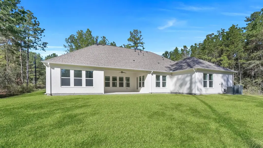 Back of home is full of windows. Plenty of yard space for anything you may want to add. Back of home is full of windows. Plenty of yard space for anything you may want to add.