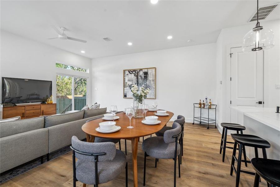 Cozy dining area seamlessly blending into the living room, making a seamless experience for entertaining.