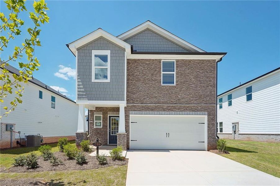 Front exterior of a new home in Martin Springs - Reserve Series, Lawrenceville, GA, highlighting curb appeal (Image 20). Front exterior of a new home in Martin Springs - Reserve Series, Lawrenceville, GA, highlighting curb appeal (Image 20).