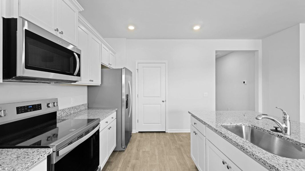 Furnished interior view inside a new home in The Ranch, Holly Hill (Image 5).