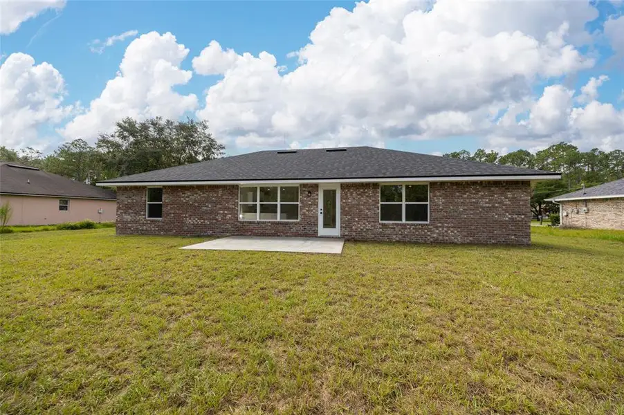 Exterior details and patio area of a home in Palm Coast, Palm Coast (Image 3).