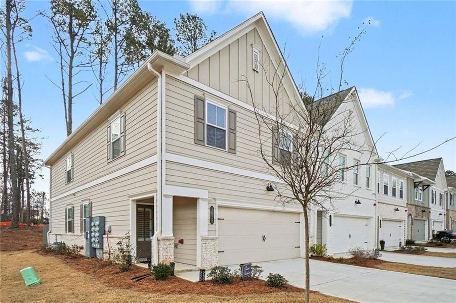 Front exterior of a new home in Gates at Hamilton Grove, Marietta, GA, highlighting curb appeal (Image 1). Front exterior of a new home in Gates at Hamilton Grove, Marietta, GA, highlighting curb appeal (Image 1).