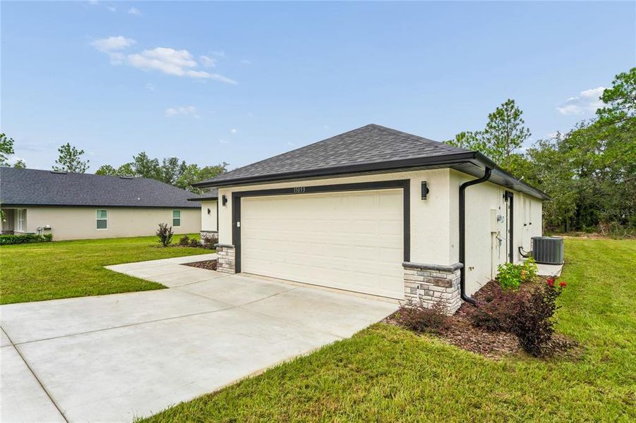 Front exterior of a new home in , Brooksville, FL, highlighting curb appeal (Image 2).