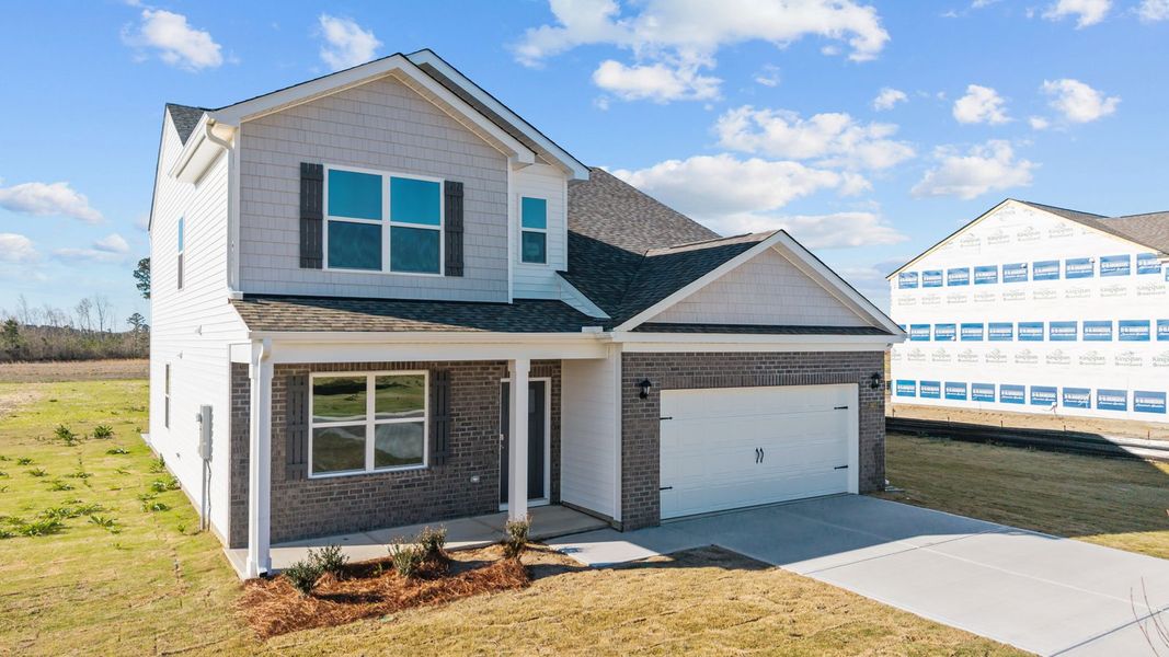 Front exterior of a new home in Beaver Dam Crossing, Bailey, NC, highlighting curb appeal (Image 2). Front exterior of a new home in Beaver Dam Crossing, Bailey, NC, highlighting curb appeal (Image 2).