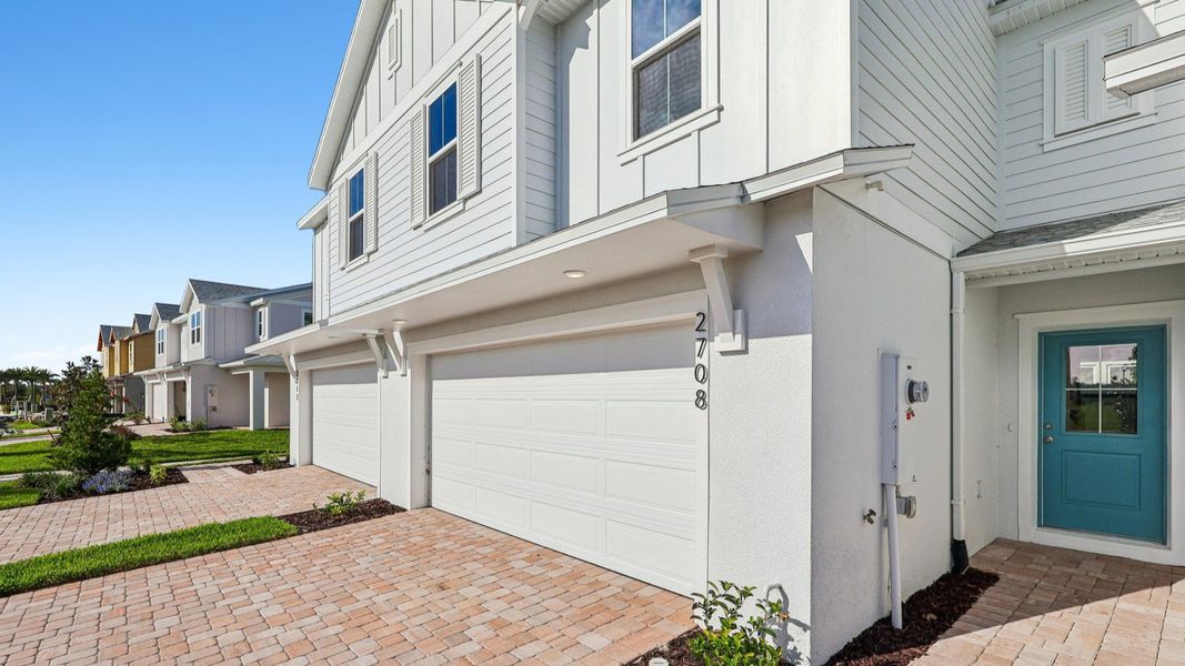 Exterior details and patio area of a home in Cyrene at Harmony, St. Cloud (Image 3).