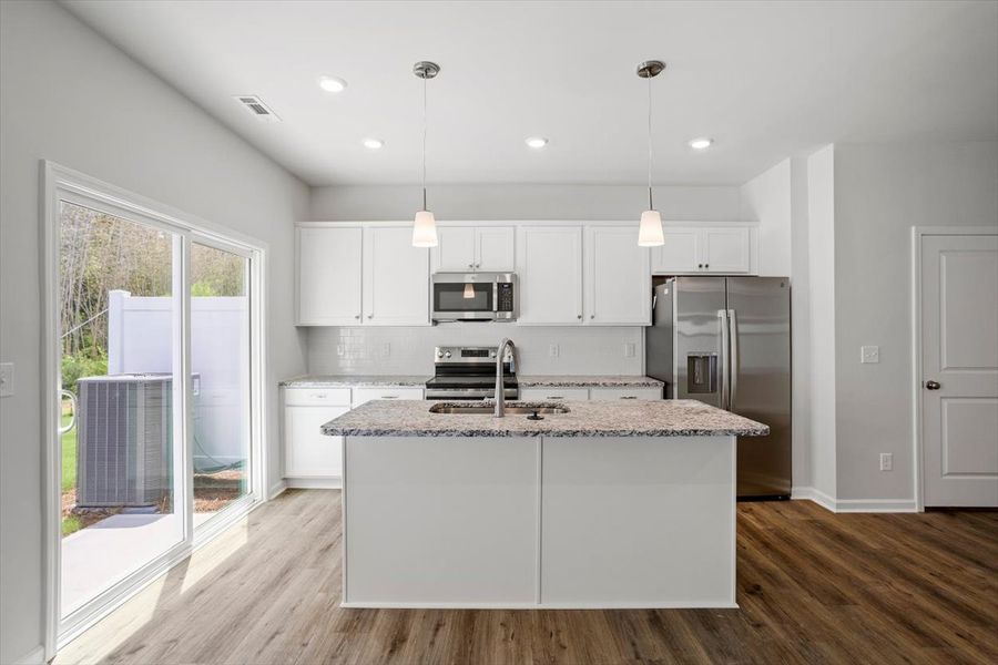 Furnished interior view inside a new home in West Main Townhomes, Sanford (Image 7).