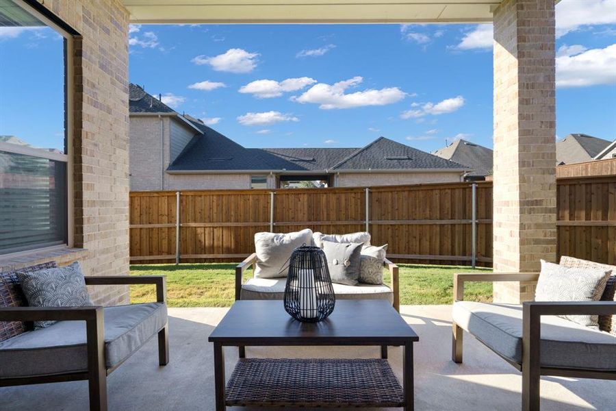 Just off the kitchen, the spacious covered patio is made for al fresco dining and easy outdoor entertaining.