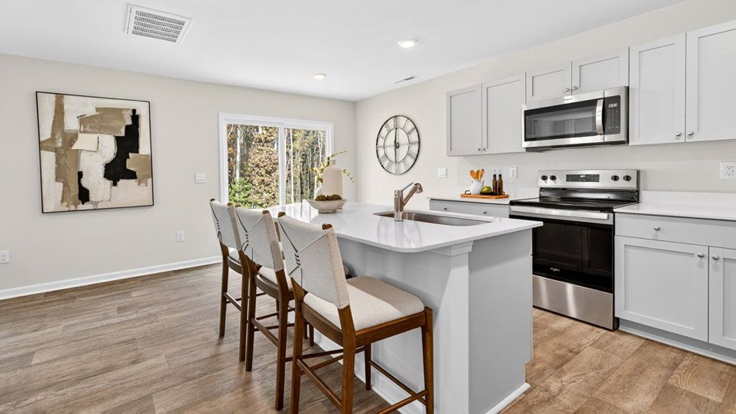 Representative furnished interior of a home built from the OLIVER by D.R. Horton in Barwell Park, Raleigh (Image 4).