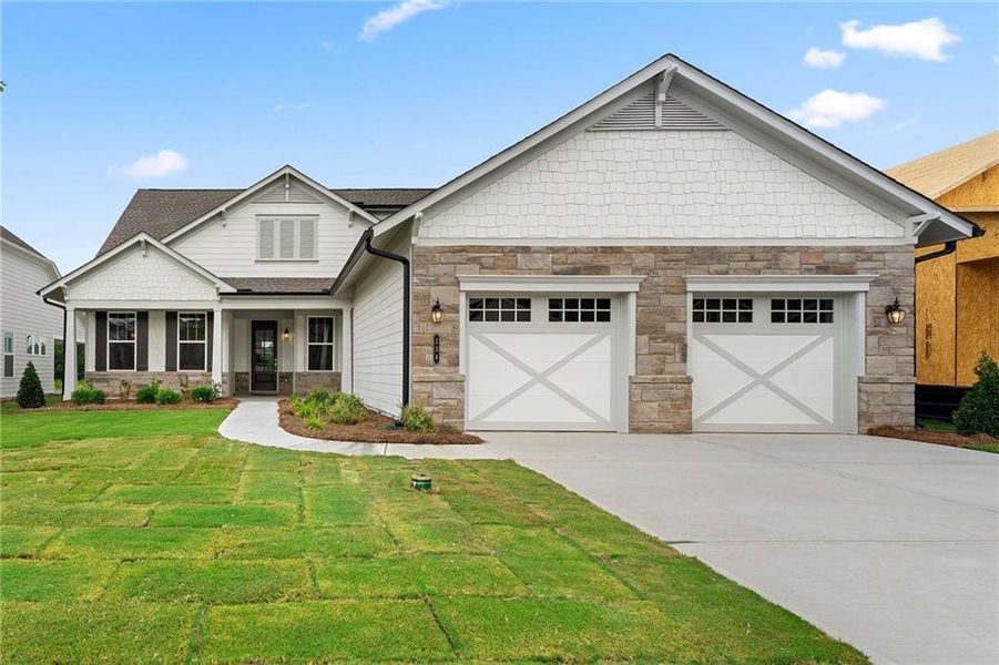 Front exterior of a new home in Cresswind Georgia at Twin Lakes, Hoschton, GA, highlighting curb appeal (Image 1). Front exterior of a new home in Cresswind Georgia at Twin Lakes, Hoschton, GA, highlighting curb appeal (Image 1).