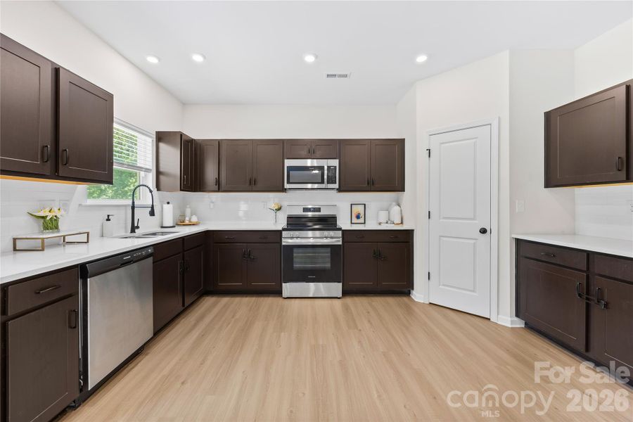 Furnished interior view inside a new home in Orchard Creek, Charlotte (Image 19).