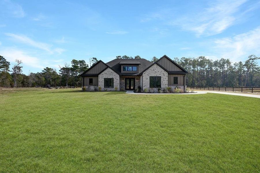 Front exterior of a new home in , Conroe, TX, highlighting curb appeal (Image 25).