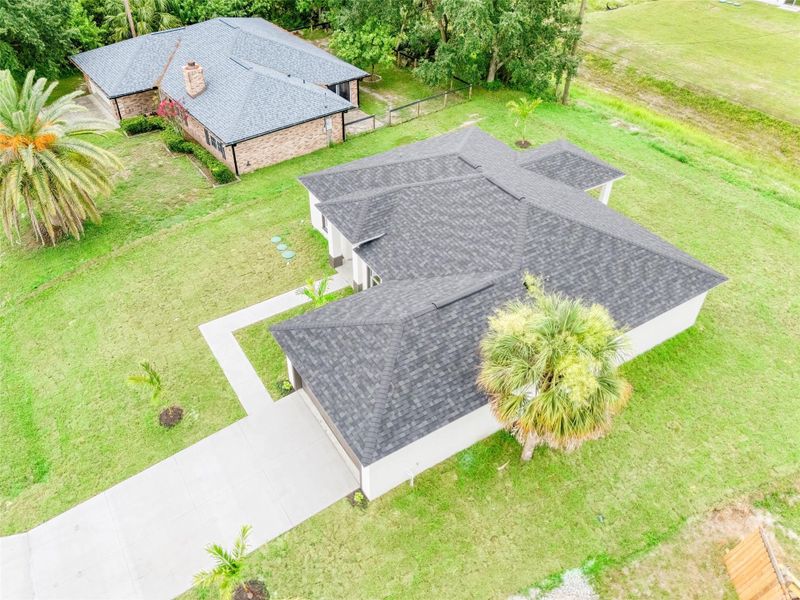 Front exterior of a new home in , Palm Bay, FL, highlighting curb appeal (Image 1).