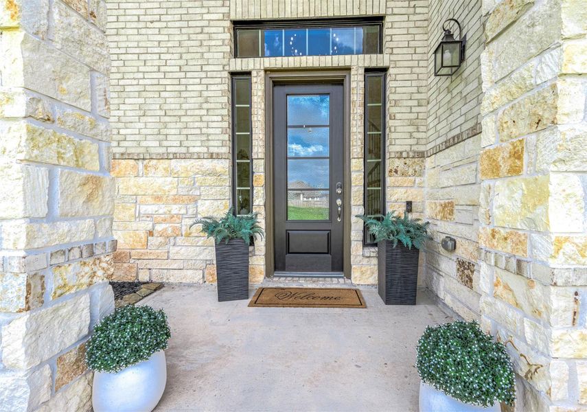 Front exterior of a new home in Sunterra 60ft, Katy, TX, highlighting curb appeal (Image 19). Front exterior of a new home in Sunterra 60ft, Katy, TX, highlighting curb appeal (Image 19).