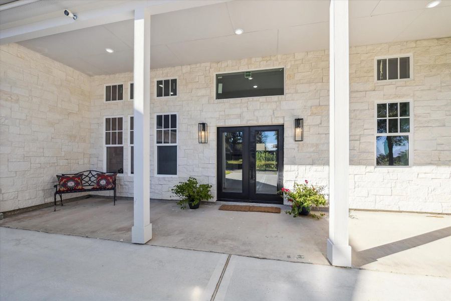 Elegant cream Austin stone on all sides of the home, gorgeous transum and double windows create an elegant Double Door Entry