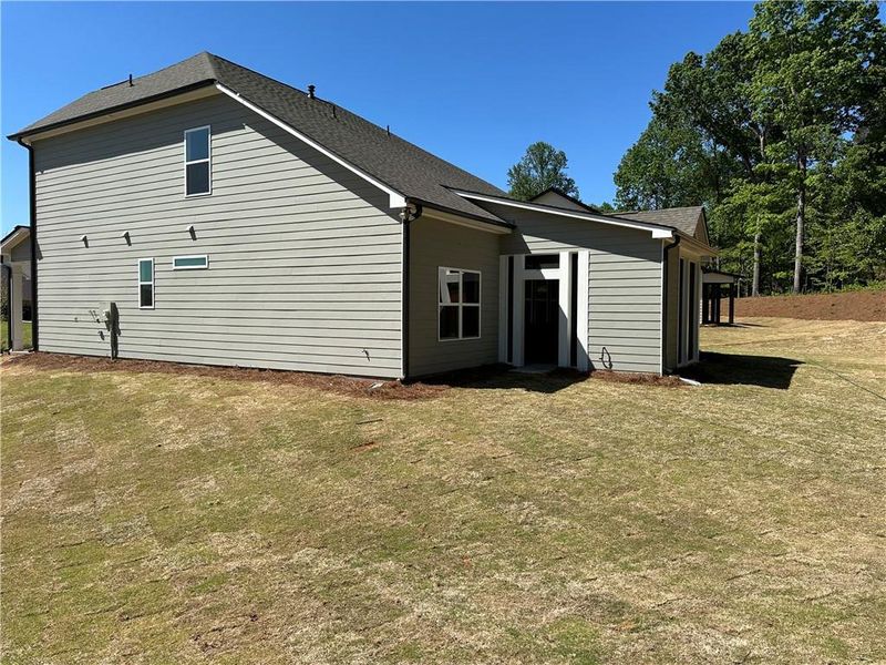 Exterior details and patio area of a home in Rosewood Lake Preserve, Hoschton (Image 23).