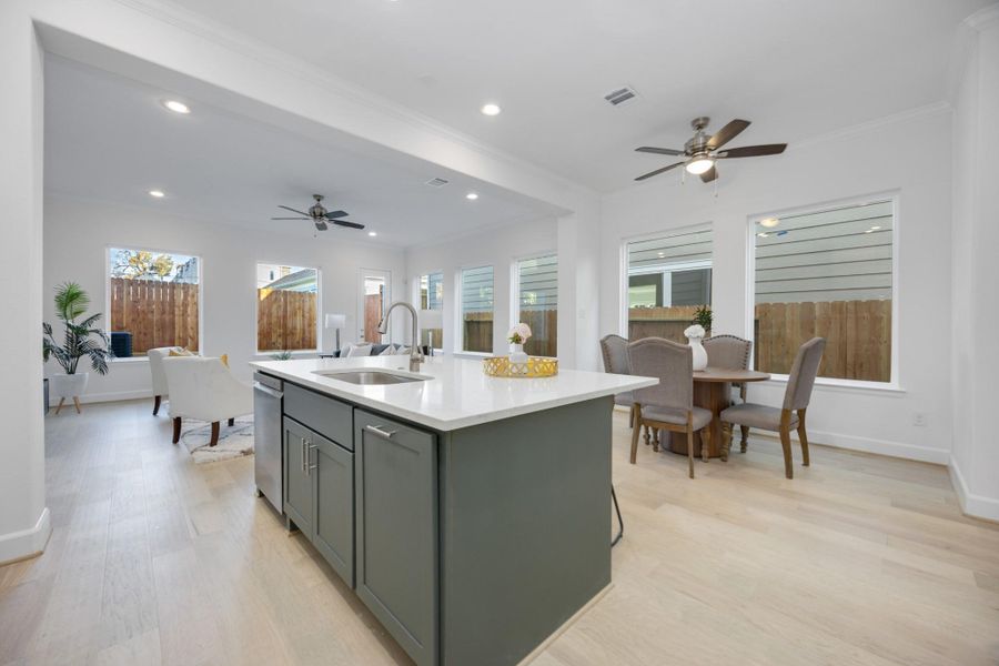 An Entertainer’s Dream LayoutWhether you’re prepping dinner or pouring wine for friends, this oversized island is the hub of the home—anchoring the kitchen, dining, and living areas with ease and elegance.
