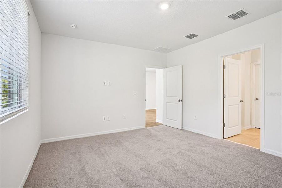 Spacious, unfurnished interior of a new home in Ridgehaven - Villas, Ormond Beach (Image 27).