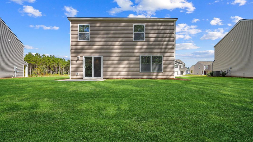 Exterior details and patio area of a home in Cobblestone Village, Savannah (Image 3).