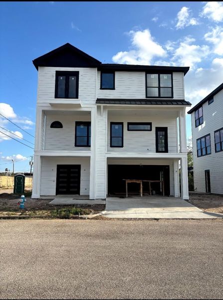 Actual Photo - 1716 Erin Street - An oversized garage with 220V capability ensures true EV readiness.