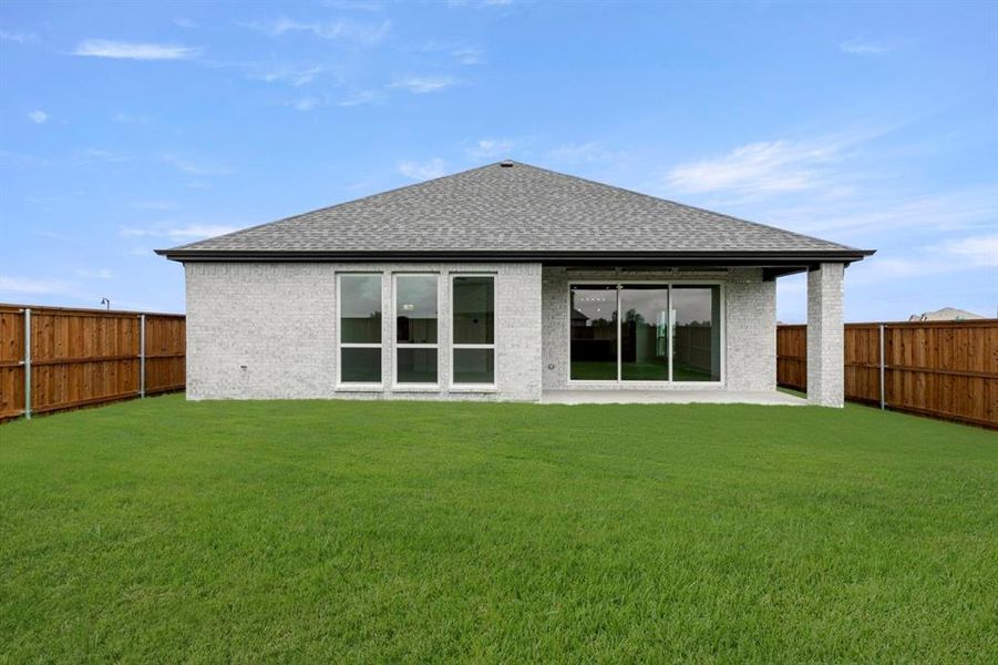 Front exterior of a new home in Las Lomas, Forney, TX, highlighting curb appeal (Image 2).