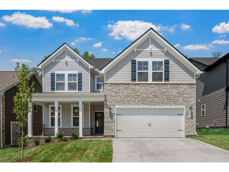 Front exterior of a new home in Woods Crossing, Gallatin, TN, highlighting curb appeal (Image 1). Front exterior of a new home in Woods Crossing, Gallatin, TN, highlighting curb appeal (Image 1).