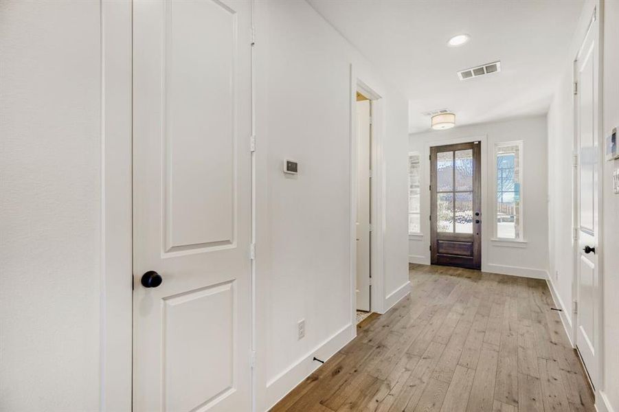 Entrance foyer featuring light wood-style floors and recessed lighting