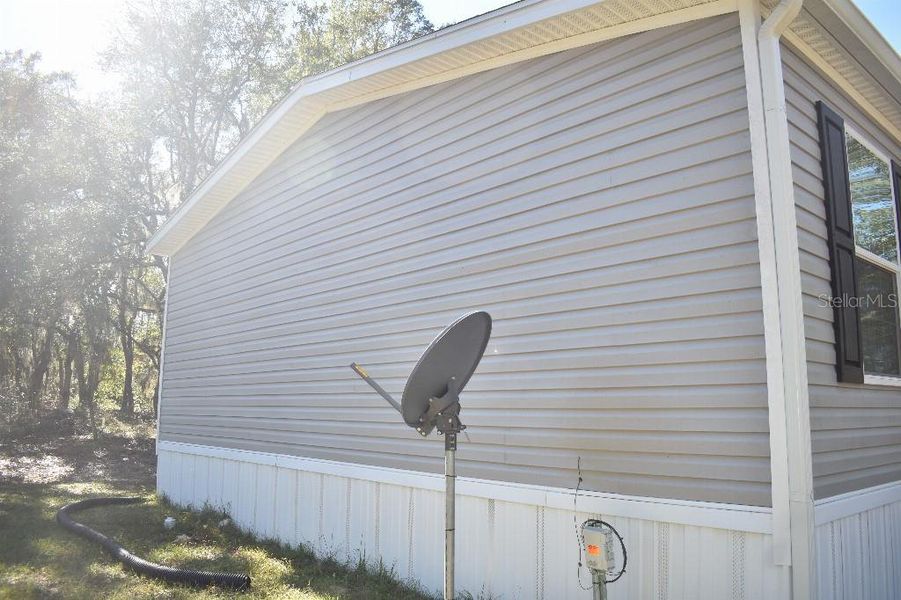 Exterior details and patio area of a home in , Williston (Image 37).