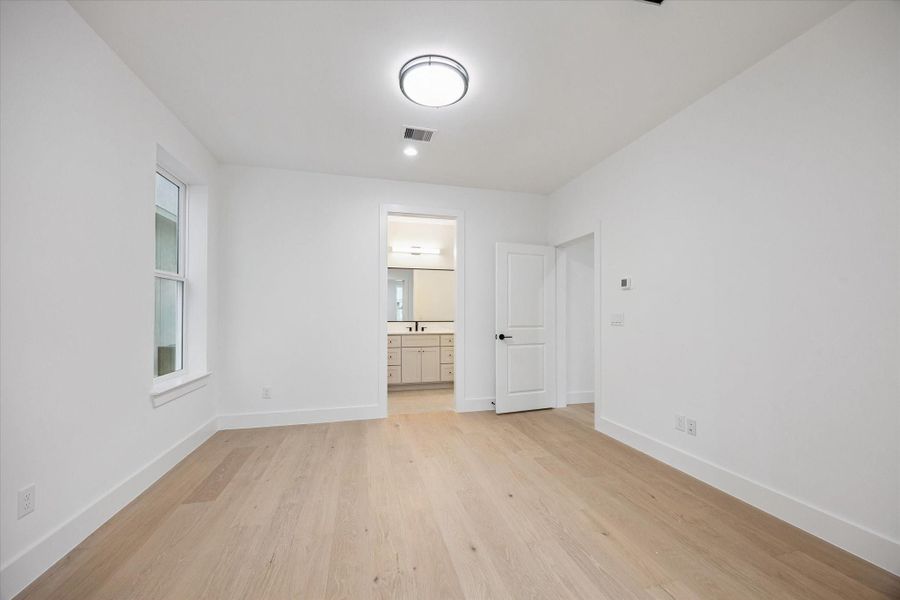 Spacious secondary bedroom offering comfort and flexibility for family or guests.