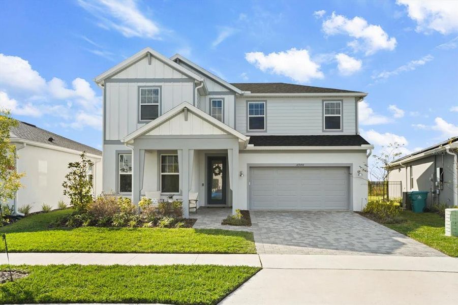 Front exterior of a new home in , Orlando, FL, highlighting curb appeal (Image 1).