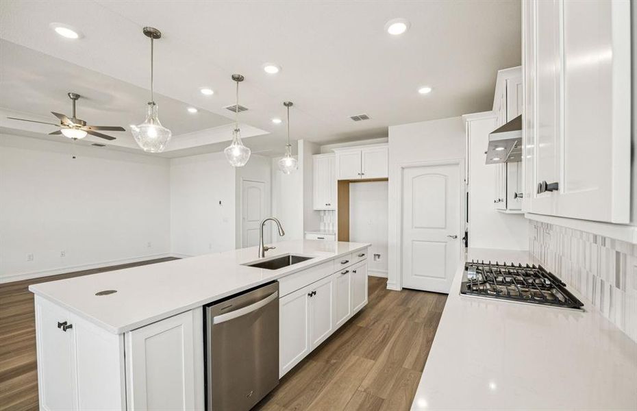 High-end gourmet kitchen with premium finishes and upgraded appliances *Real home pictured High-end gourmet kitchen with premium finishes and upgraded appliances *Real home pictured
