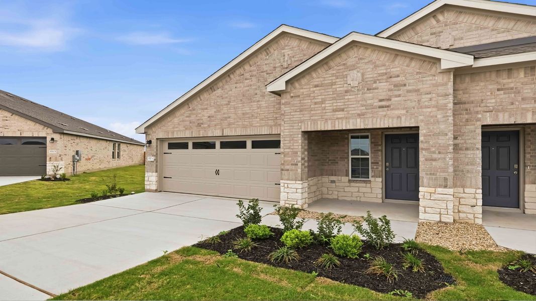 Representative exterior photo of a completed home built from the The Magnolia by D.R. Horton in Palomino, Manor, TX (Image 15).