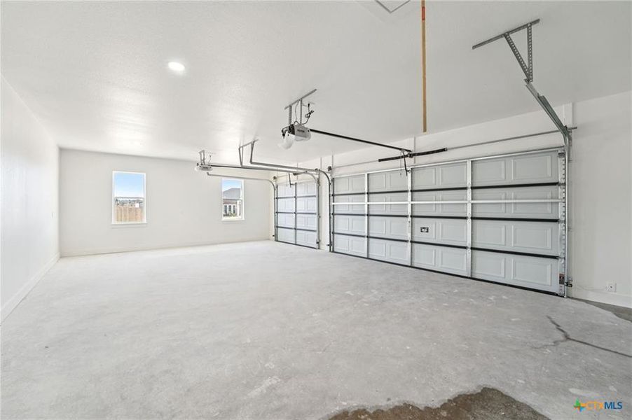 Secure parking is provided by this generously proportioned garage with multiple bays. Secure parking is provided by this generously proportioned garage with multiple bays.