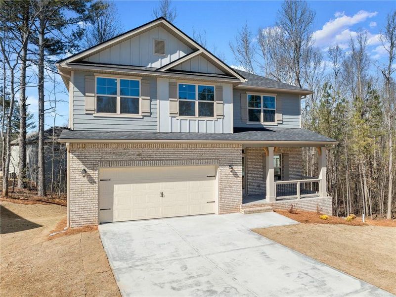 Front exterior of a new home in Magnolia Villas, Cornelia, GA, highlighting curb appeal (Image 24).
