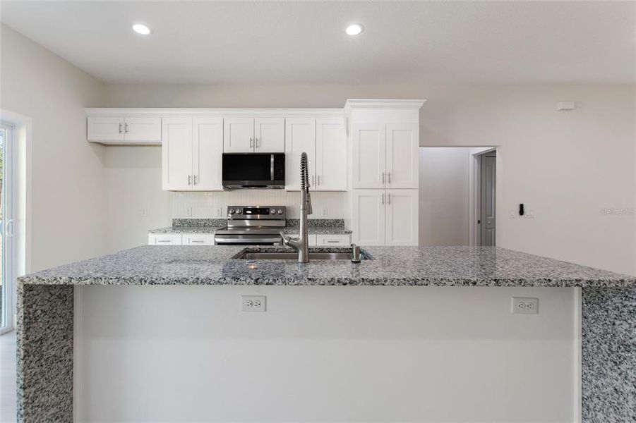 Furnished interior view inside a new home in , Indian Lake Estates (Image 6).