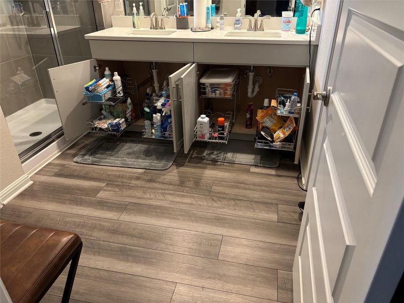 Detailed view of wood finished floors and a sink