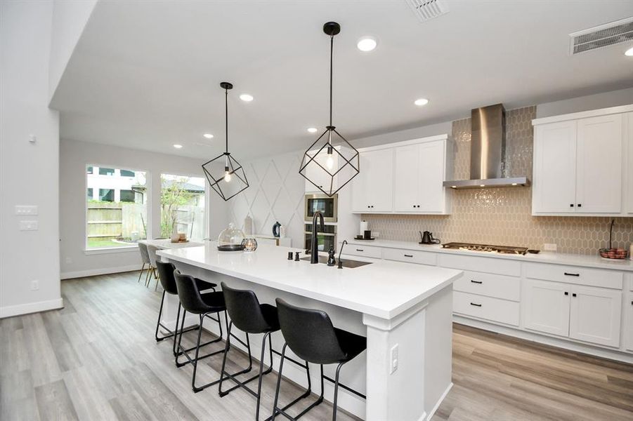 This Beautiful kitchen offers Quartz Countertop, lots of cabinets, Stainless Steel Kitchen Hood.