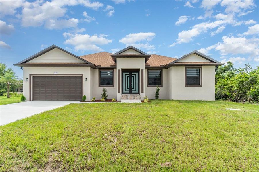 Front exterior of a new home in , Port Charlotte, FL, highlighting curb appeal (Image 20). Front exterior of a new home in , Port Charlotte, FL, highlighting curb appeal (Image 20).