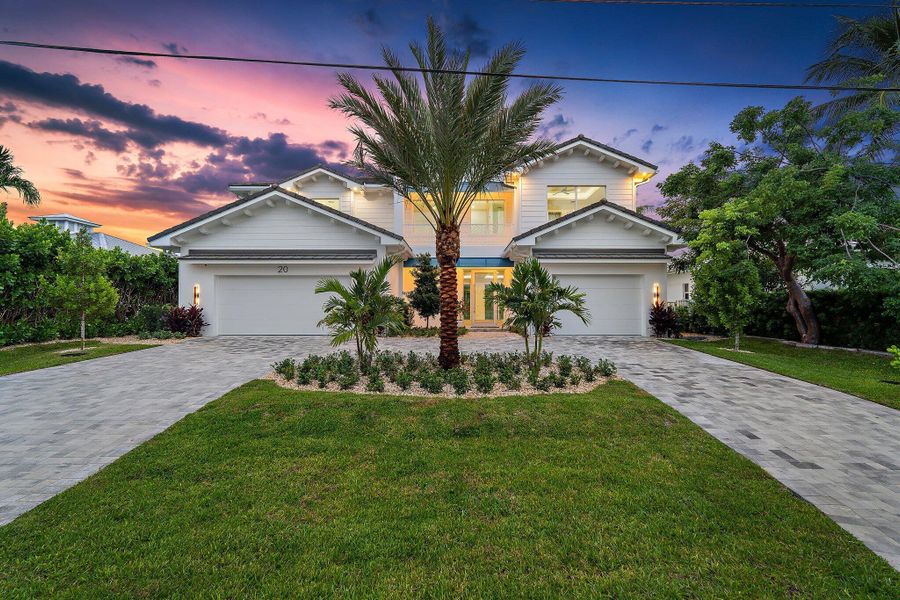 Front exterior of a new home in , Tequesta, FL, highlighting curb appeal (Image 26). Front exterior of a new home in , Tequesta, FL, highlighting curb appeal (Image 26).