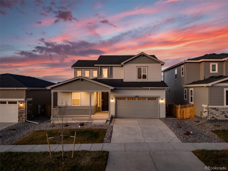 Front exterior of a new home in Floret Collection at Alder Creek, Parker, CO, highlighting curb appeal (Image 2).
