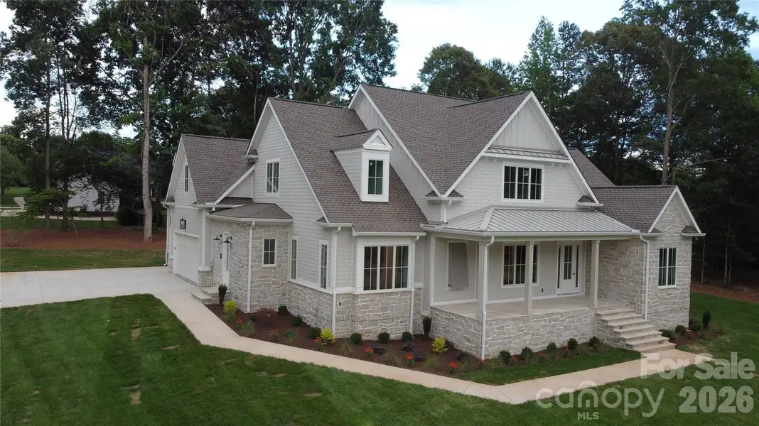 Front exterior of a new home in , Mooresville, NC, highlighting curb appeal (Image 1). Front exterior of a new home in , Mooresville, NC, highlighting curb appeal (Image 1).