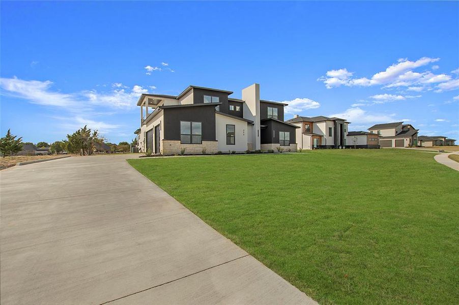 View of front of property with a front lawn