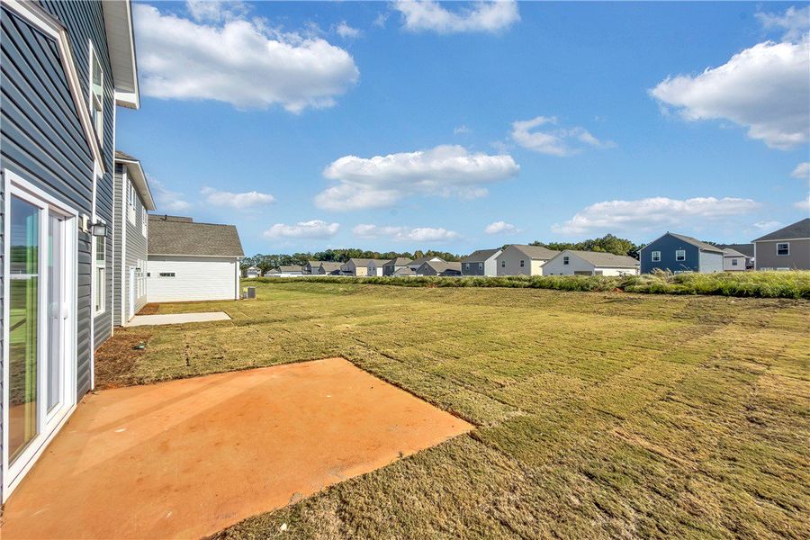 Exterior details and patio area of a home in Brownstone Park, Easley (Image 16).