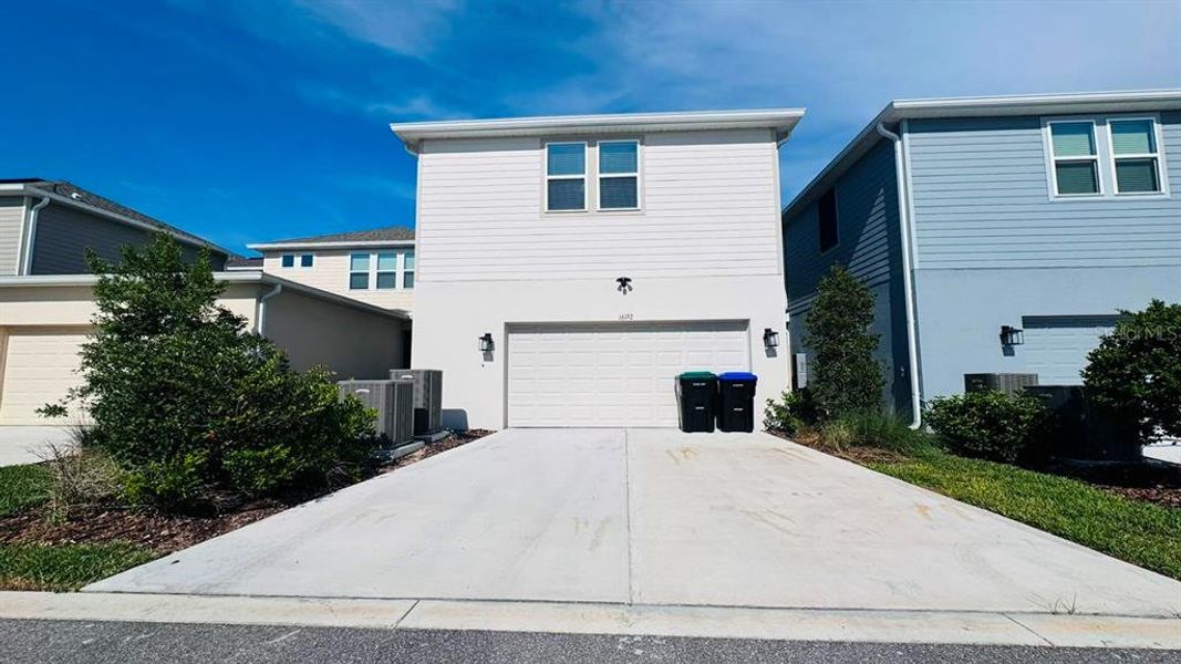 Front exterior of a new home in Harvest at Ovation, Winter Garden, FL, highlighting curb appeal (Image 28).