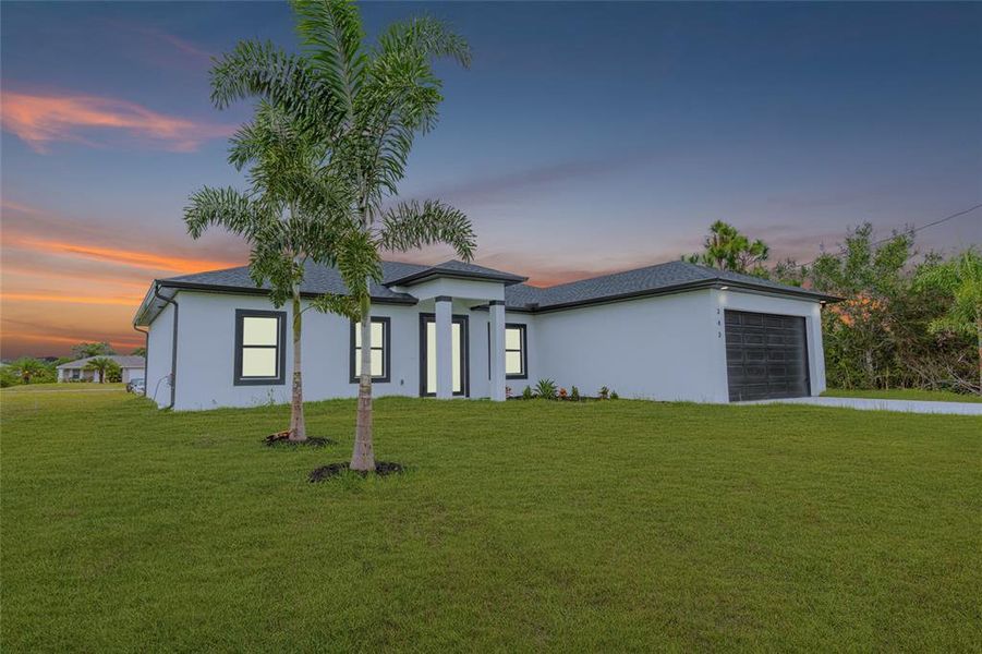 Front exterior of a new home in , Lehigh Acres, FL, highlighting curb appeal (Image 1). Front exterior of a new home in , Lehigh Acres, FL, highlighting curb appeal (Image 1).