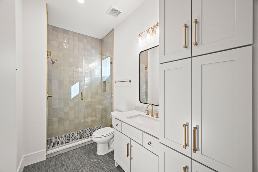 The gorgeous bath also offers access to the huge walk-in closet!
