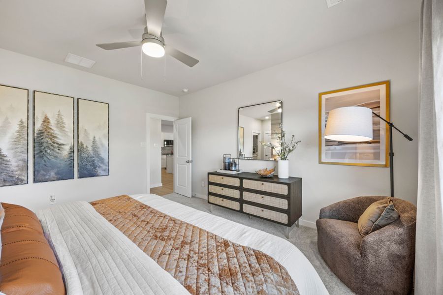 A bedroom with a bed and a couch. A bedroom with a bed and a couch.